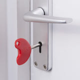 Red LOKKO Radar key in door lock for disabled toilet access with comfortable grip.